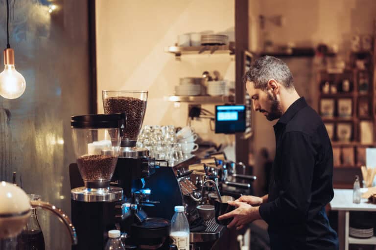 Barista preparing coffee at a43