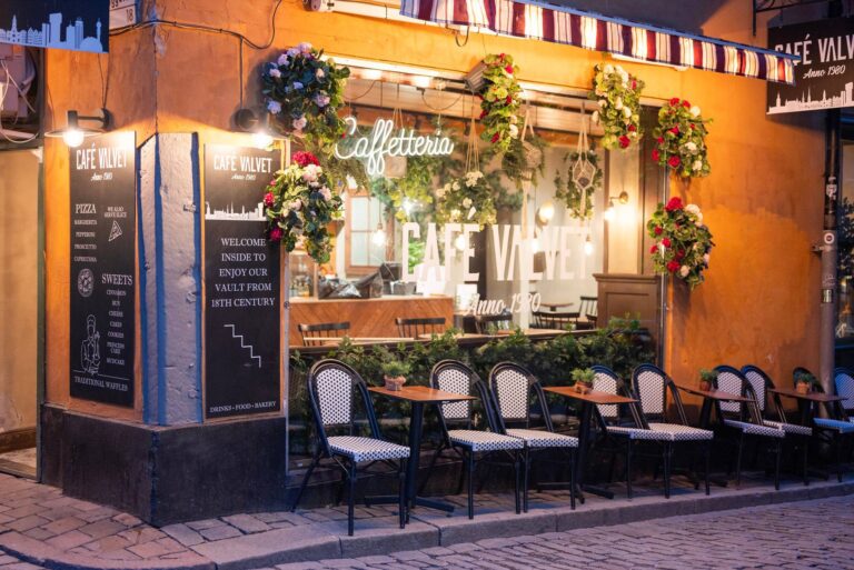 Cafe Valvet i stockholm sweden med view of the summer terrace in the evening in a cozy cafe with lights